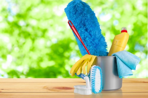 Technician handling carpet cleaning machinery safely